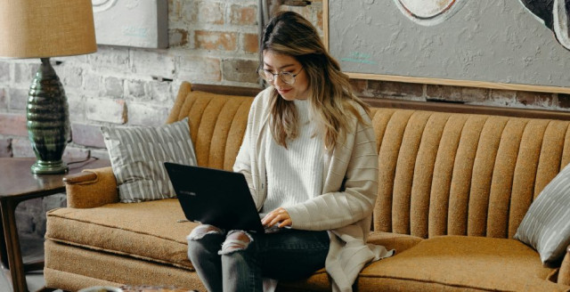 Woman working on a laptop at a coffee shop