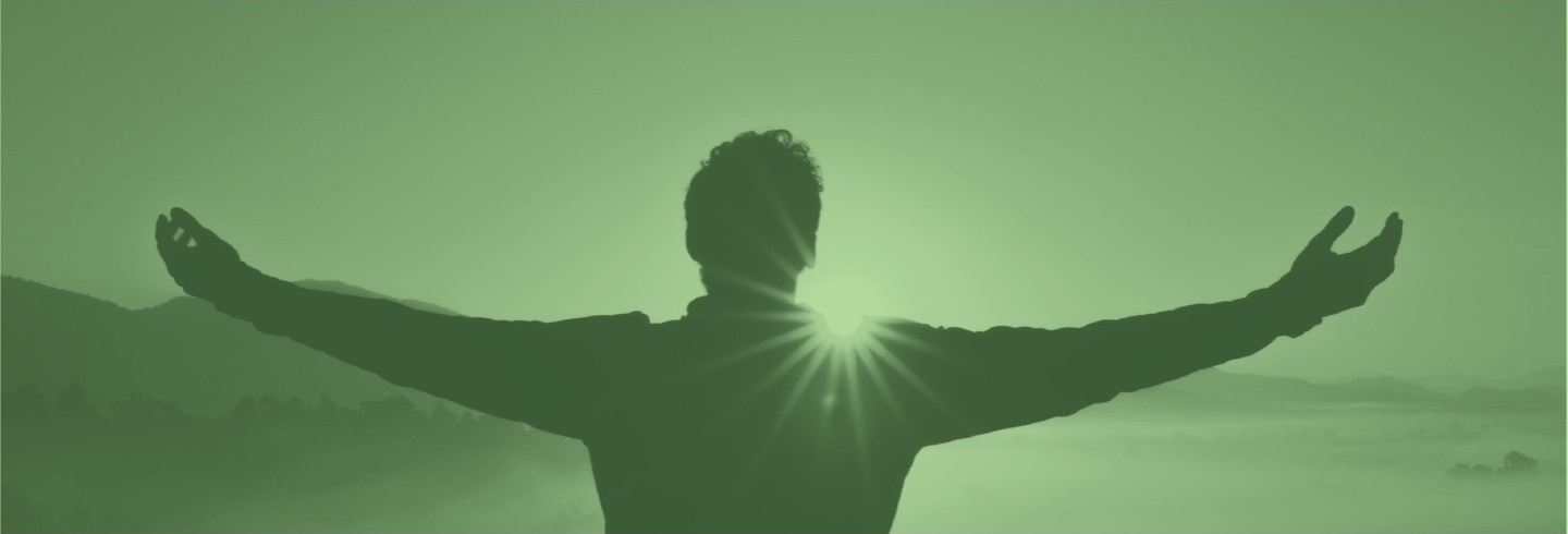 Man raising his arms in success, overlaid in a color filter of Duo green